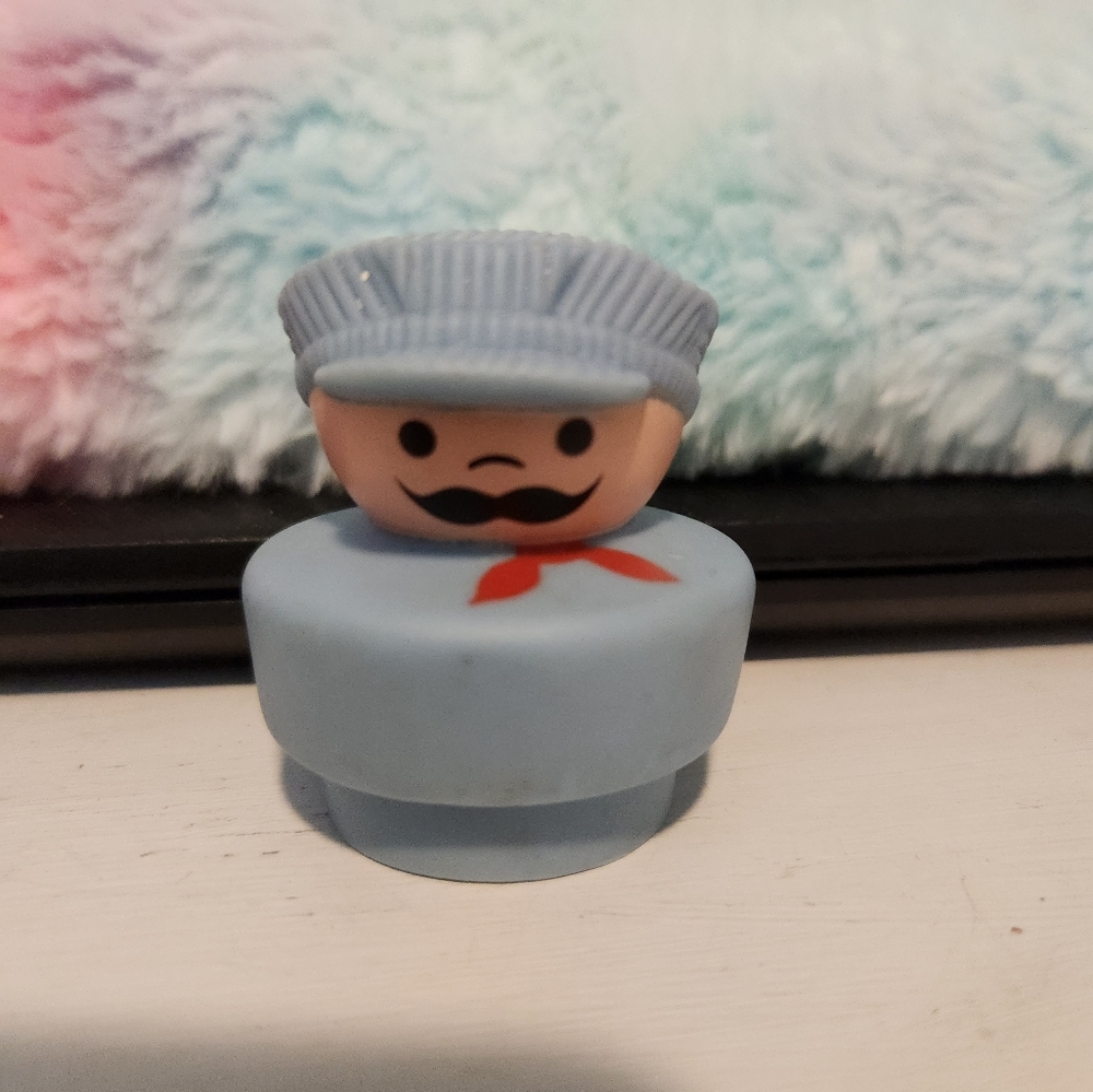 Vintage Fisher Price Little People train engineer.